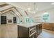Open living area with a gourmet kitchen, stone fireplace, and hardwood floors at 912 Oak Dr, Woodstock, GA 30189