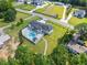 Aerial view of home with backyard pool, lounge area, outdoor kitchen, and manicured lawn at 1336 Azalea Dr, Lawrenceville, GA 30043