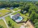 An aerial view of a modern two-story home with a well manicured lawn, pool and patio at 1336 Azalea Dr, Lawrenceville, GA 30043