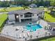 A modern two-story home with a pool, patio and lots of exterior space for entertaining and relaxation at 1336 Azalea Dr, Lawrenceville, GA 30043