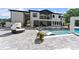Stunning backyard with a modern pool, stylish patio furniture, and lush landscaping provides a luxurious outdoor retreat at 1336 Azalea Dr, Lawrenceville, GA 30043