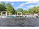 Sprawling backyard showcasing a luxurious pool, a water feature, lounging areas, and a covered patio for relaxation at 1336 Azalea Dr, Lawrenceville, GA 30043