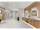 Bright bathroom featuring double vanities, glass enclosed shower, and modern fixtures at 1336 Azalea Dr, Lawrenceville, GA 30043
