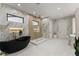 Stunning bathroom with a modern black soaking tub and a glass-enclosed walk-in shower at 1336 Azalea Dr, Lawrenceville, GA 30043