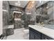Modern bathroom featuring gorgeous marble tile shower, sleek vanity, and gold-tone hardware at 1336 Azalea Dr, Lawrenceville, GA 30043