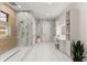 Spa-like bathroom with walk-in shower, vanity, and dressing table with modern fixtures at 1336 Azalea Dr, Lawrenceville, GA 30043