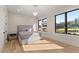 Bright bedroom with large windows, hardwood floors, and a modern chandelier at 1336 Azalea Dr, Lawrenceville, GA 30043