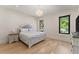 Serene bedroom with hardwood floors, soft lighting, and a cozy bed, providing a comfortable and relaxing retreat at 1336 Azalea Dr, Lawrenceville, GA 30043
