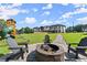 Inviting backyard fire pit area with comfortable seating, perfect for outdoor entertaining and relaxing at 1336 Azalea Dr, Lawrenceville, GA 30043