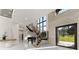Sun-lit foyer showcasing contemporary staircase design, grand windows, and stylish decor for an inviting entrance at 1336 Azalea Dr, Lawrenceville, GA 30043