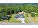 Modern two-story home with a well manicured front lawn, dark gray roof and a long driveway at 1336 Azalea Dr, Lawrenceville, GA 30043