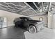 Upscale garage featuring an elegant ceiling design, epoxy flooring, and ample space at 1336 Azalea Dr, Lawrenceville, GA 30043