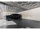 Upscale garage featuring an elegant ceiling design, epoxy flooring, and ample space at 1336 Azalea Dr, Lawrenceville, GA 30043
