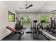 Home gym with exercise equipment and large windows offering views of the surrounding nature at 1336 Azalea Dr, Lawrenceville, GA 30043