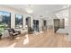 Bright hallway with a sitting area, featuring modern railing and light fixture, and views from expansive windows at 1336 Azalea Dr, Lawrenceville, GA 30043