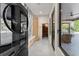 Hallway featuring modern design, wood cabinets, sauna entrance, and view to the patio at 1336 Azalea Dr, Lawrenceville, GA 30043