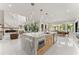 Expansive open concept kitchen with marble island, seating, stainless steel appliances, and modern design at 1336 Azalea Dr, Lawrenceville, GA 30043