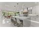 Stunning kitchen with a large marble island, stainless steel appliances, and elegant pendant lighting at 1336 Azalea Dr, Lawrenceville, GA 30043