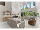 Bright living room features a soaring fireplace, hardwood floors, and abundant natural light from large windows at 1336 Azalea Dr, Lawrenceville, GA 30043