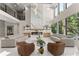 Bright living room features a soaring fireplace, hardwood floors, and abundant natural light from large windows at 1336 Azalea Dr, Lawrenceville, GA 30043