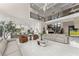 Spacious living room featuring a modern staircase, sleek furniture, and abundant natural light at 1336 Azalea Dr, Lawrenceville, GA 30043