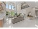 Open-concept living room featuring sleek furnishings, tall windows, and bright tile floors, creating a spacious atmosphere at 1336 Azalea Dr, Lawrenceville, GA 30043