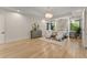Spacious bedroom features hardwood floors, ample natural light, chandelier and accent wall at 1336 Azalea Dr, Lawrenceville, GA 30043