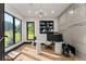 Well-lit office space featuring modern desk, ample storage, and scenic views through large windows, ideal for productivity at 1336 Azalea Dr, Lawrenceville, GA 30043