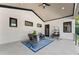 Relaxing covered patio with rocking chairs, a swing, and stylish decor at 1336 Azalea Dr, Lawrenceville, GA 30043