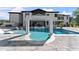 Luxury pool featuring a spa and modern design elements, set against a backdrop of a grand home at 1336 Azalea Dr, Lawrenceville, GA 30043