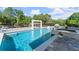 Luxurious pool area boasting a spa, sun loungers, and lush greenery at 1336 Azalea Dr, Lawrenceville, GA 30043