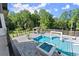 Aerial view of the stunning pool area, complete with a hot tub, gazebo, and ample lounge space at 1336 Azalea Dr, Lawrenceville, GA 30043