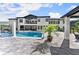 Expansive patio with a pool and spa, perfect for outdoor entertaining, complemented by a modern home at 1336 Azalea Dr, Lawrenceville, GA 30043