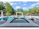 Modern pool with spa and stylish features, set in a beautifully landscaped backyard at 1336 Azalea Dr, Lawrenceville, GA 30043