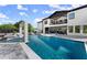 Beautiful pool with spa and tanning ledge, surrounded by a spacious patio and modern home at 1336 Azalea Dr, Lawrenceville, GA 30043