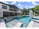 Stunning backyard with a large pool, sun loungers, spa, and a modern two-story home at 1336 Azalea Dr, Lawrenceville, GA 30043