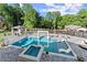 Stunning pool and spa area with a gazebo, tanning chairs, and lush landscaping at 1336 Azalea Dr, Lawrenceville, GA 30043