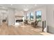 Inviting sitting area featuring a sleek fireplace with marble surround and bright views from large windows at 1336 Azalea Dr, Lawrenceville, GA 30043