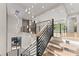 Elegant staircase with modern railing and a decorative chandelier, enhancing the home's interior with stylish design elements at 1336 Azalea Dr, Lawrenceville, GA 30043