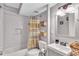 Charming bathroom featuring subway tiles, a shower-tub combo, and stylish fixtures with coordinated decor for a spa-like experience at 2418 Bolling Brook Sw Dr, Atlanta, GA 30311