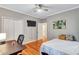 Functional bedroom with a desk, ceiling fan, and closet at 2418 Bolling Brook Sw Dr, Atlanta, GA 30311