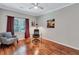 Comfortable office/bedroom features a cozy chair, sleek desk, and ample natural light from the window at 2418 Bolling Brook Sw Dr, Atlanta, GA 30311