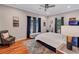Spacious bedroom featuring hardwood floors, natural light, and a sitting area for relaxation at 2418 Bolling Brook Sw Dr, Atlanta, GA 30311