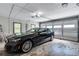Spacious garage showcasing a sleek black car, offering secure parking and additional storage solutions for convenience at 2418 Bolling Brook Sw Dr, Atlanta, GA 30311