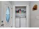 Convenient laundry closet adjacent to the entryway and front door at 2418 Bolling Brook Sw Dr, Atlanta, GA 30311