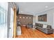 Spacious living room with a fireplace, stylish furniture, and an open view of the backyard through large doors at 2418 Bolling Brook Sw Dr, Atlanta, GA 30311