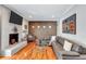 Bright living room with a brick fireplace, comfortable seating, and an art-adorned accent wall at 2418 Bolling Brook Sw Dr, Atlanta, GA 30311
