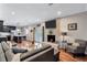 Open floor plan showcases a kitchen leading to a cozy living room with a fireplace and comfortable seating at 2418 Bolling Brook Sw Dr, Atlanta, GA 30311