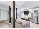 Comfortable living room showcasing modern finishes, a large television, and access to the staircase, perfect for relaxing and entertaining at 2418 Bolling Brook Sw Dr, Atlanta, GA 30311