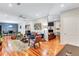 Spacious living room featuring hardwood floors, modern decor, and a seamless layout at 2418 Bolling Brook Sw Dr, Atlanta, GA 30311
